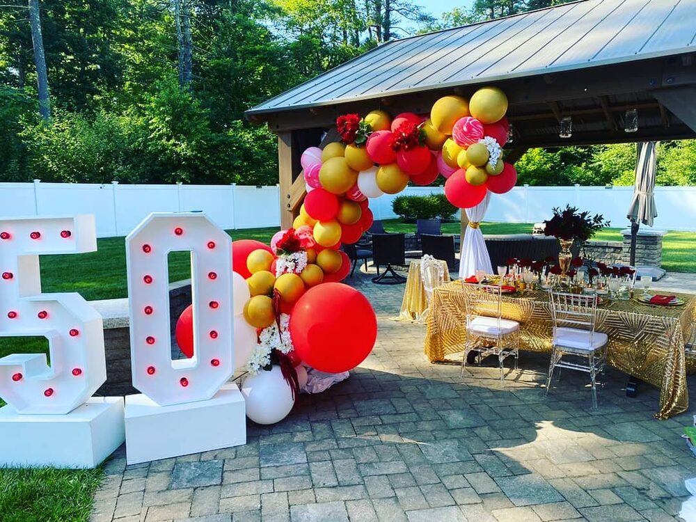 Red and gold balloon arch, 50th birthday marquee numbers