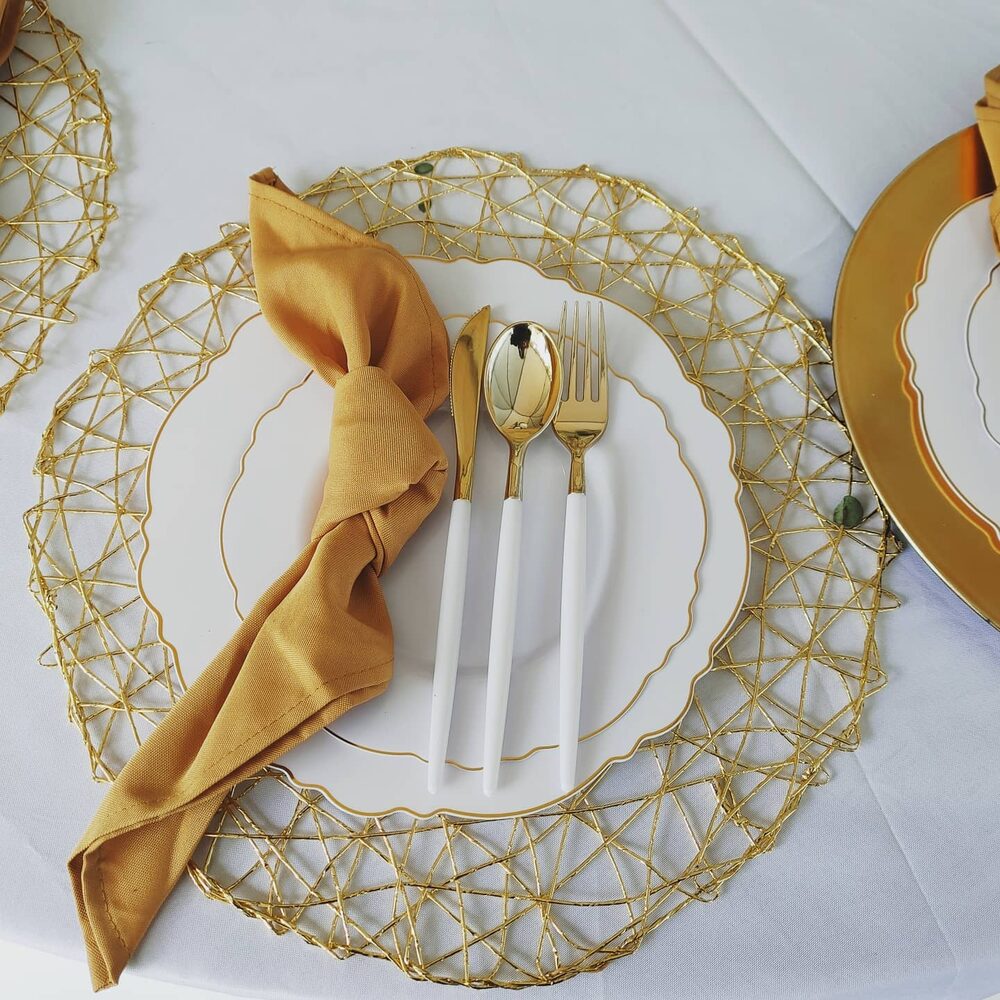 Gold place setting with mustard-yellow napkin
