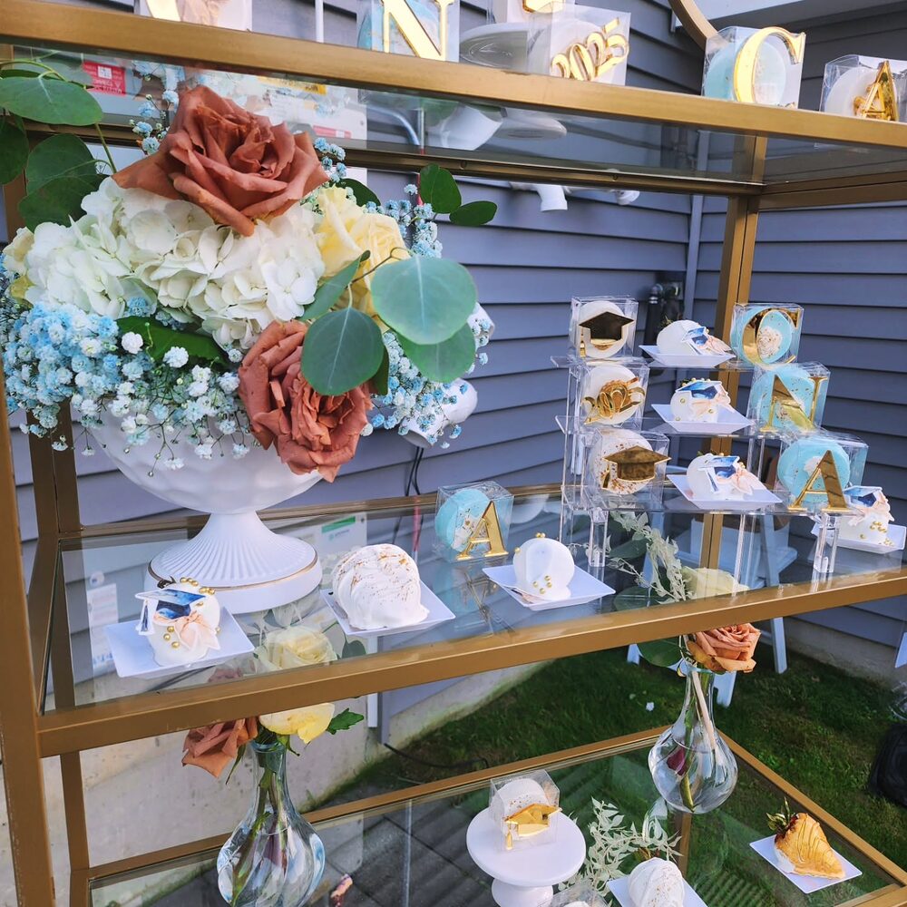 Graduation dessert shelf in rust, cream, blue, and gold