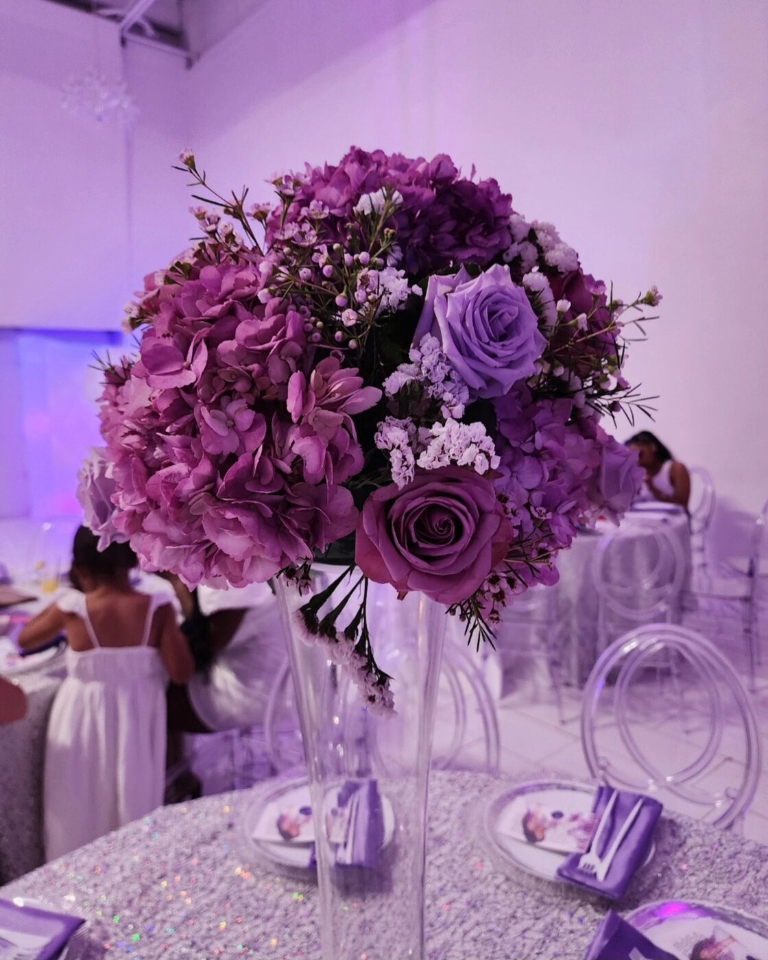 Purple and lavender rose and hydrangea centerpiece