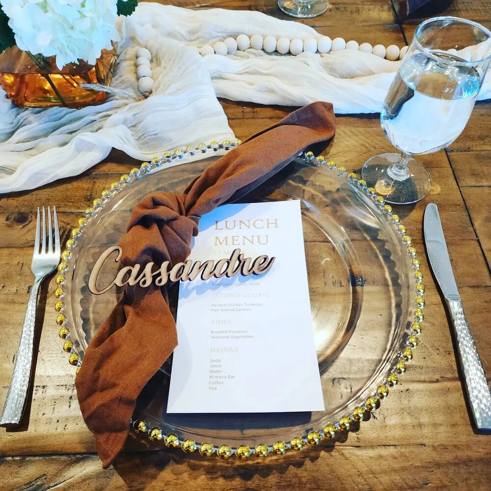 Rustic lunch place setting in brown and cream on a wood table