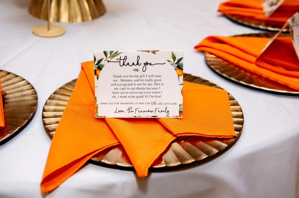 Thank-you card at an orange citrus-themed place setting